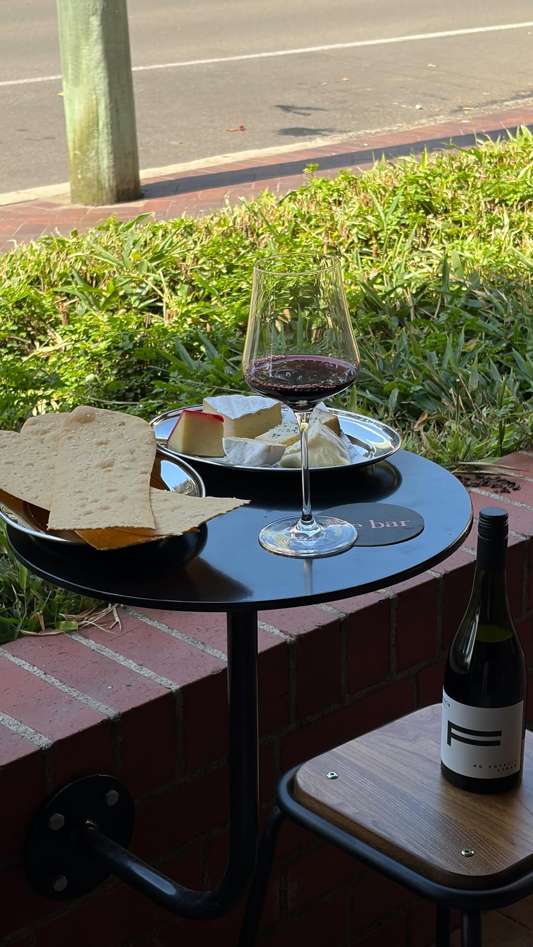 Wine and cheese plate on the outdoor bar